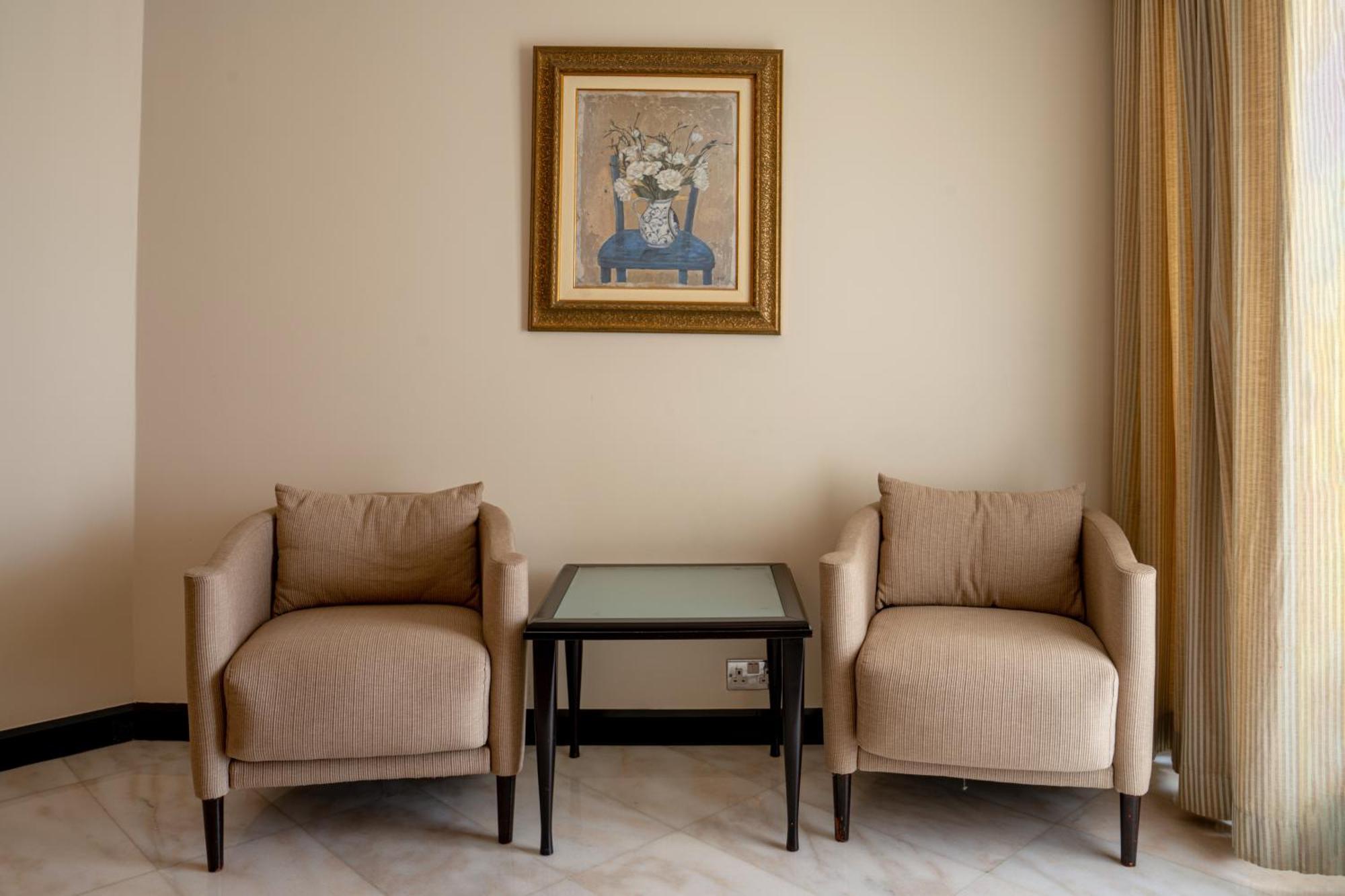Danat Al Ain Resort Eksteriør bilde Two club chairs
